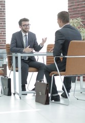 business partners behind a Desk