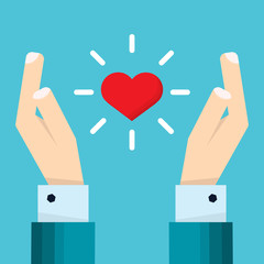 Hand of businessman holds a heart floating between two hands