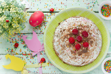 Easter quark dessert cheese paska decorated with raspberry and chocolate