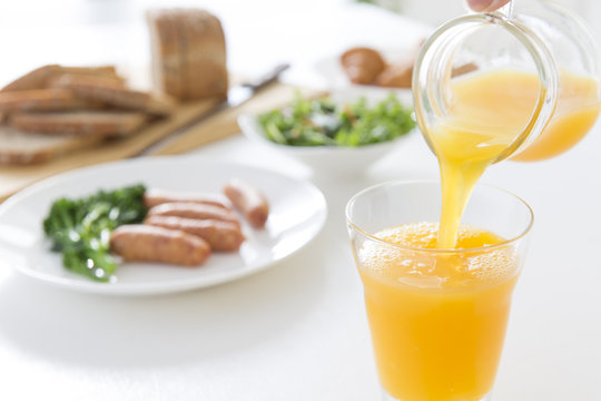 Pour orange juice