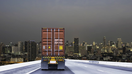 Truck on road with container, transportation concept.,import,export logistic industrial Transporting Land transport on the asphalt expressway with city night background