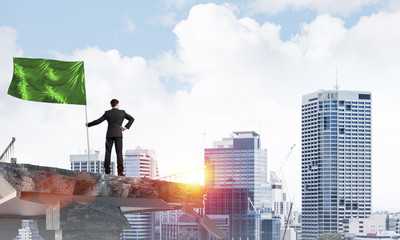 Man with flag presenting leadership concept.