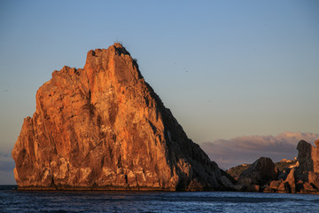 Fototapeta na wymiar Sunrise Red rock and sea landscape, cape, sea cliffs 
