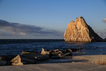 Sunrise Red rock and sea landscape, cape, sea cliffs 