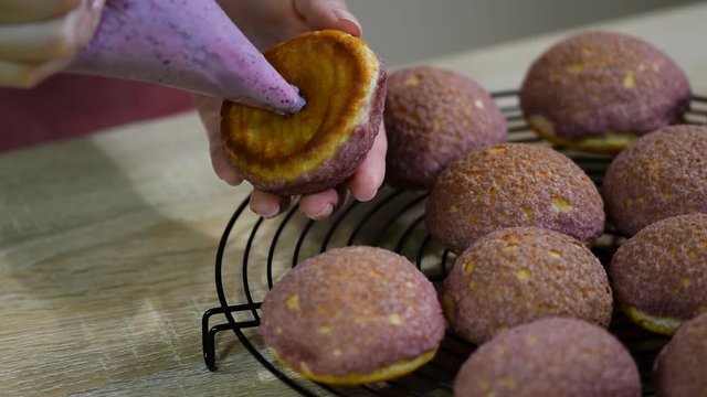 Cream puffs with cracelin filling blueberry cream