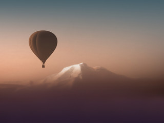 silhouette hot air balloon flying over the mountains. wonderful landscape mountain view copyspace. air sports travel aerostat