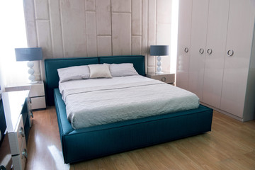 Interior of cozy bedroom with pillows on bed in modern design