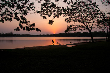 Woman and her bike in the morning
