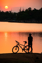 Fototapeta premium Woman and her bike in the morning