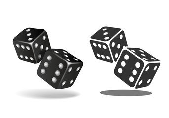 Two black falling dice isolated on white.