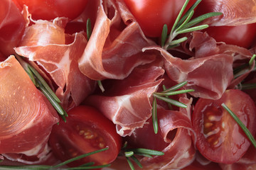  Prosciutto with  rosemary and tomatoes .