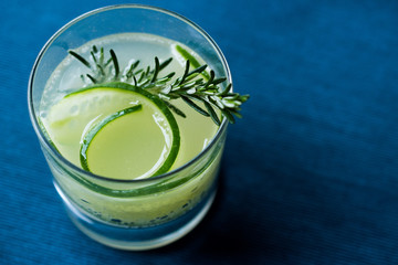 Rosemary Gin Gimlet Cocktail with Cucumber Slice.