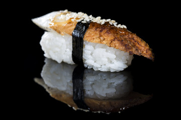 Japanese cuisine. Appetizing conger and rice on dark background