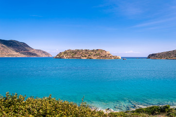 Fototapeta na wymiar The island of Spinalonga is located in the Gulf of Elounda in north-eastern Crete opposite to the traditional fishing village of Plaka.In the past lepers were isolated there.
