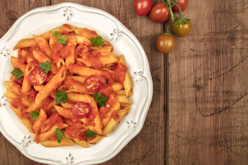 Penne pasta with tomato sauce and place for text