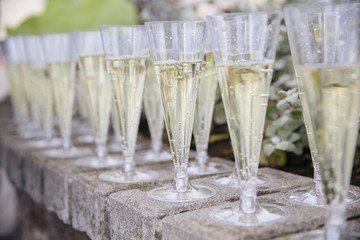 Full Champagne Glasses on a stone ledge