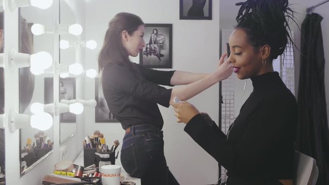 Woman fashion model making selfie photo in makeup room
