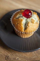 Muffin with cherry on top
