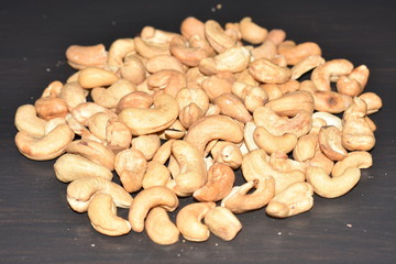 Cashew nuts on the black table, black background