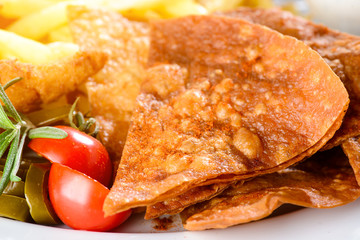Food background with tomato and roasted spicy bread, close-up