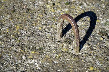 Rusty Clip for old concrete slabs with moss, outdoor background
