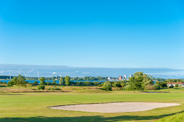 Fototapeta na wymiar Golfplatz am Wulfener Hals mit Blick nach Burgstaaken, Insel Fehmarn