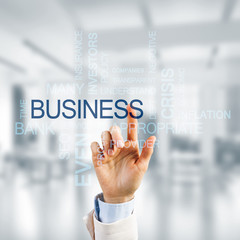 Concept of modern business with palm choocing on of keywords for success