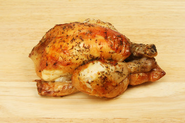 Roasted poussin on a board