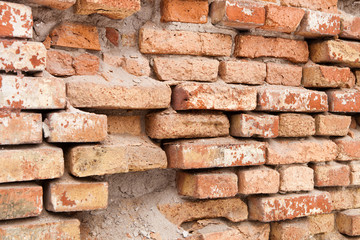Brick wall collapsing from erosion