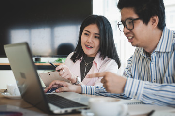 Man and woman workers talking in coffee shop