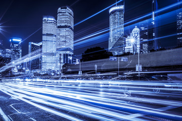 Blurred traffic light trails on road
