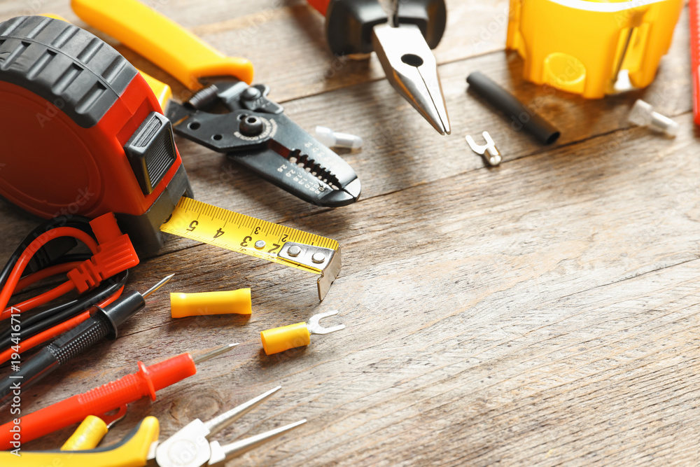 Wall mural different electrical tools on wooden background