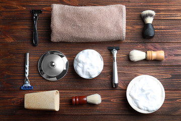 Shaving accessories for man on wooden background