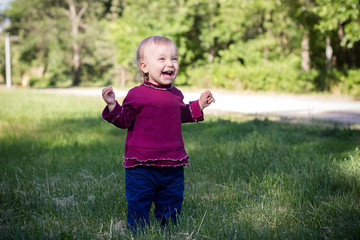 Happy little girl having fun at the park