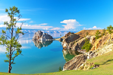  Baikal Lake. Rocky coast of Olkhon Island and Shamanka Rock - a natural landmark on a sunny June...