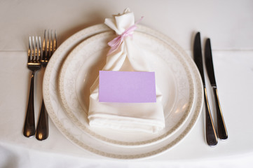 Festively decorated table for wedding celebration in restaurant.