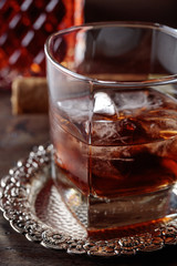 Glass of scotch whiskey and natural ice .