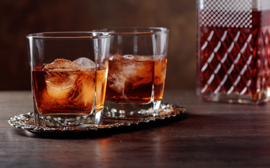 Glass of scotch whiskey and natural ice .