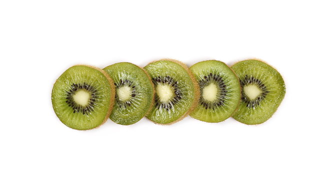 Kiwi fruit slices isolated on white background, top view