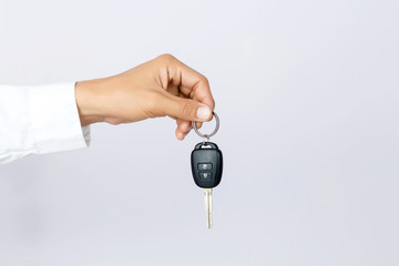 Businessman holding the  car key, isolated background