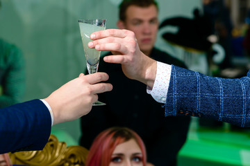 Unknown man giving cocktail another man, shallow dof