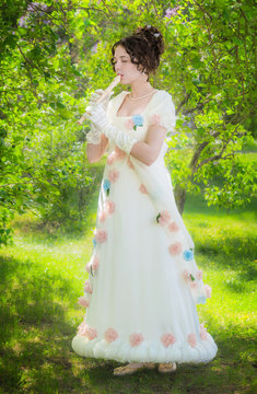 girl musician with a flute in the garden.