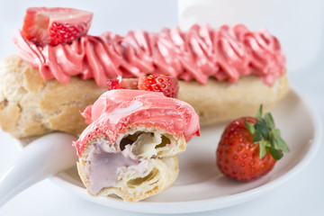 Appetizing sweet dessert. Cake with cream in a white plate