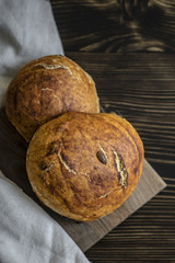 Freshly baked bread on dark  kitchen table