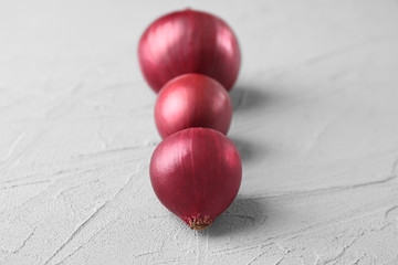 Red onion on light background