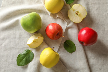 Ripe juicy apples on cloth, top view
