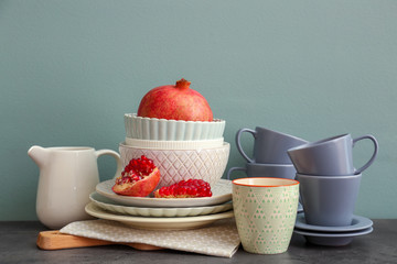 Set of dishware with fruit on table