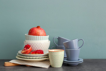 Set of dishware with fruit on table