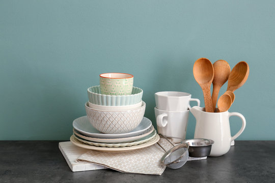 Set of cooking utensils and dishware on table