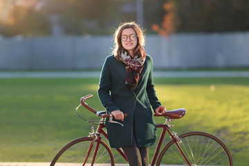 Hipster girl with vintage bicycle
